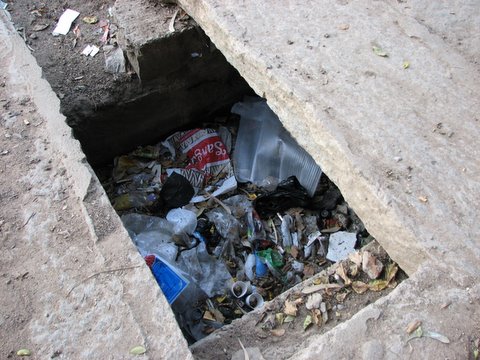 plastic trash in the storm water drain