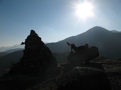 ken lounging on rocky peak