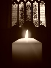 photo of a candle burning at st luke's church, holloway
