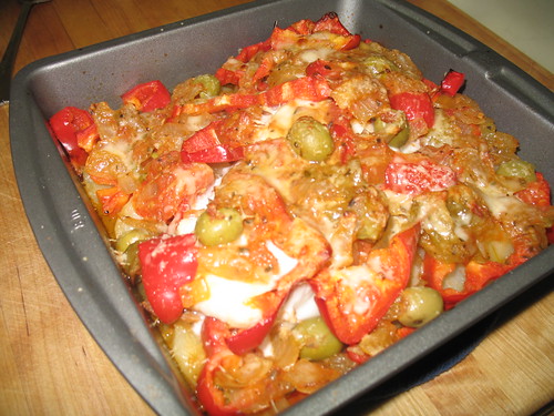 Baked Halibut over potatoes, olives, red peppers, and marinara