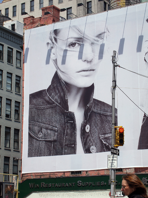 big face on billboard, Houston Street, Manhattan, NYC