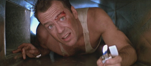 John McClane (Bruce Willis) in a tight spot