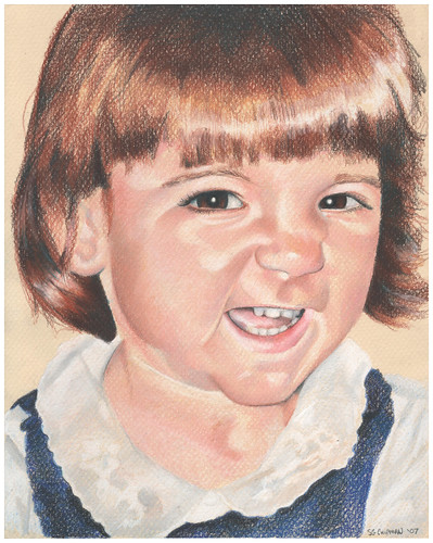 Colored pencil portrait of my daughter grinning like a loon.