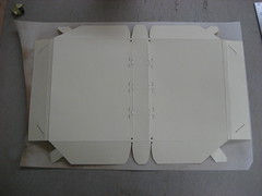 The template for the cover laid over a sheet of vellum
