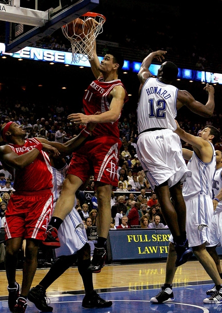 Yao Ming throws down a dunk over Orlando center Dwight Howard Friday night.  Yao finished with 26 points and 10 rebounds to lead the Rockets to a 96-94 victory.  He had plenty of help though, including Rafer Alston, Aaron Brooks, Luther Head and Luis Scola.