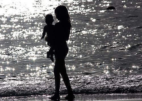 Black and White Silhouette of a girl and a baby boy