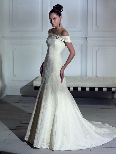 Here is a pretty gown with a wide strap shoulder and long train