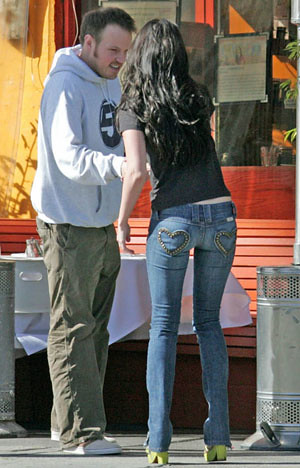 Megan Fox skinny jeans, green heels