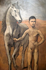 boy leading a horse