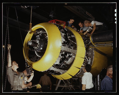Warbird picture - Mounting motor [on a] Fairfax B-25 bomber, at North American Aviation, Inc., plant in [Inglewood], Calif.