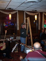 J.R. Jenks plays Dr. Donald R. Kanner's washtub bass at the Lincoln Restaurant's banjo night