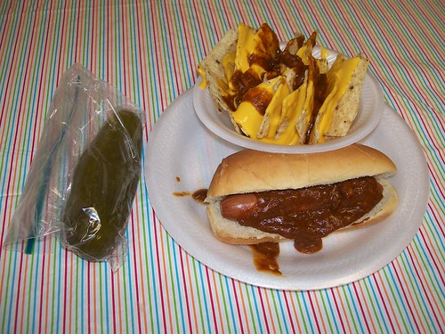 lunch: chili hot dog, chili cheese nachos and a dill pickle