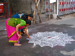 India - Sights & Culture - Women drawing an in...