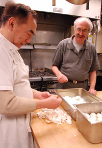 John Lee and Al Mitchell prepare a meal at the Lookout shelter.