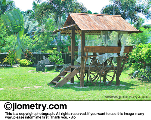 A cool wooden shelter with ladder and attached with wheels