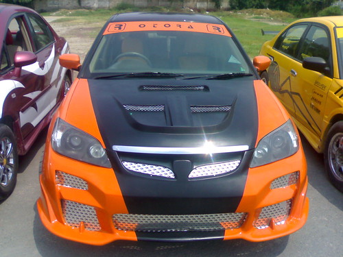 A tricked out Honda Civic with a body kit.