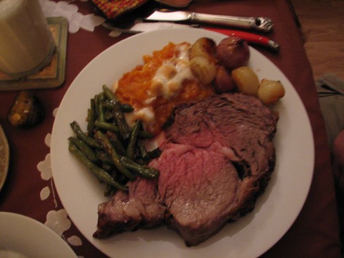 standing rib roast, whipped sweet potatoes, green beans and boiler onions