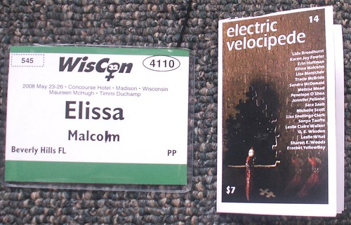 WisCon Badge and folded EV Flyer