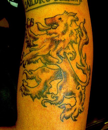 Comments: A red lion rampant symbolizing Scotland, tattooed on the back of