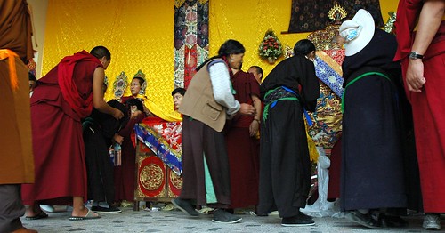 Reception line - Tibetan Buddhists being blessed by the young Sakya Lama HE Avikritar Rinpoche, Amitayus Hayagriva Long Life, Tharlam Monastery stage, Boudha, Kathmandu, Nepal by Wonderlane