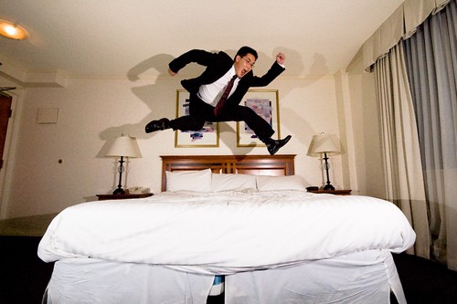 hotel room jump while wearing a suit