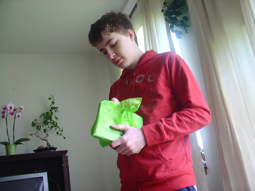 Opening a present from MoMo's care package.