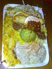 Amigos Oaxaca plate- a chicken enchilada, chilli verde, beef taquito, guacamole, sour cream, salsa, salad & rice. $19.90