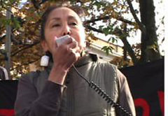Norris speaking at a protest in October.