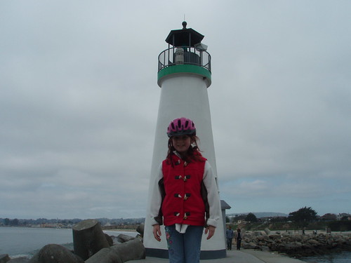 bike helmet front. Bike helmet girl in front of the lighthouse.