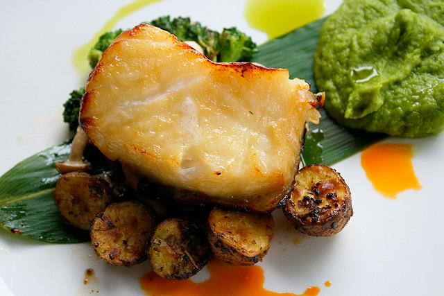 Chilean Seabass, miso marinated and served with sauteed mushrooms and mashed green peas