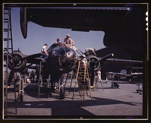 Warbird picture - Employees on the &quot;Sunshine&quot; assembly line at North American's plant put the finishing touches on another B-25 bomber, Inglewood, Calif. In addition to the battle-tested B-25 (&quot;Billy Mitchell&quot;) bomber, used in General Doolittle's raid on Tokyo, this plant 