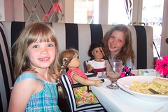 Cambria and Emmae have lunch with their dolls