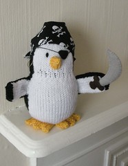 Knitted pirate penguin doll