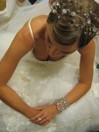 This is a crystal beaded headband tiara that wraps around the bride's head 