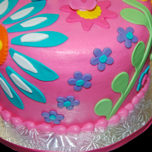 3rd birthday colorful floral patterned cake closeup view