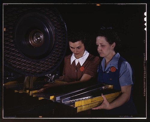 Warbird picture - Punching rivet holes in a frame member for a B-25 bomber, the plant of North American Aviation, Inc., Calif.