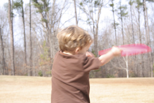 Oliver throwing frisbee