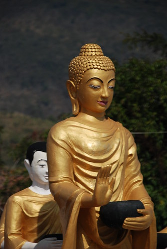 Buddha and monk in Thachilek, Myanmar