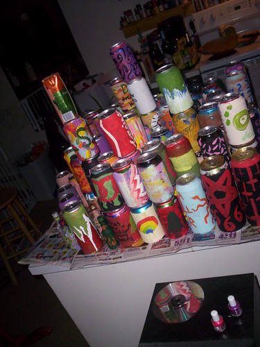 artistically stacked cans with reflection