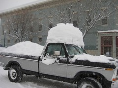 Lots of snow on a truck