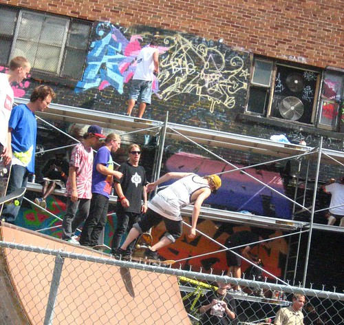 Skating at Under Pressure, 2008, with some graffiti being made in the background. Fun times. Click image for source.