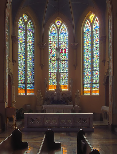 Sainte Genevieve Roman Catholic Church, in Sainte Genevieve, Missouri, USA - stained glass windows in transept