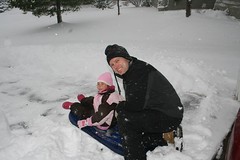 Em and Dad sledding