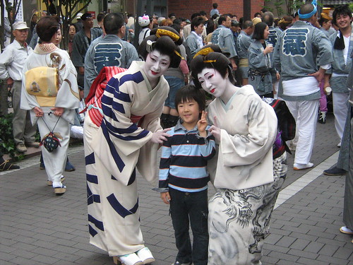 Little boy looks happy with the geisha