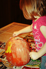 Painting her pumpkin