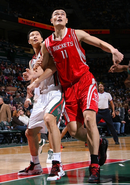 Yao Ming and Yi Jianlian battle for position Saturday night in a much anticipated match-up.  The game didn't turn out as expected, with Yao and Yi both struggling from the field.