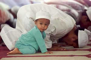 Muslim Kid Praying by GunnerPress.