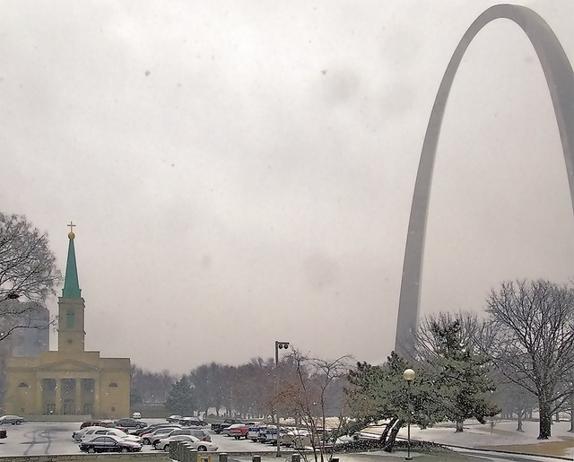Basilica of Saint Louis, King of France, and Gateway Arch, in Saint Louis, Missouri, USA - during snowfall