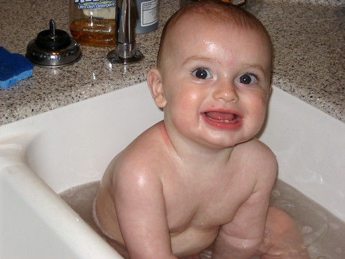 obligatory baby getting a sink bath pic