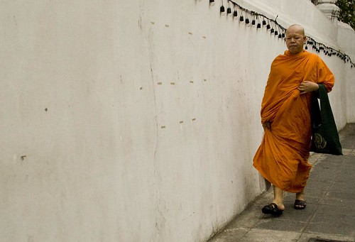 Monk by wall